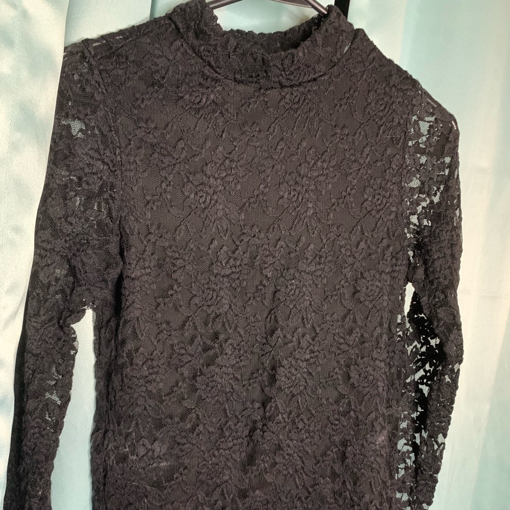 Black lace long sleeve shirt is a medium fits like a small